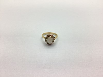 Lot 250 - A 9ct Gold Cluster Ring, oval claw set centre,...