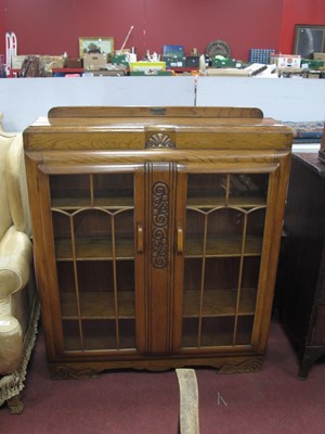 Lot 1498 - XX Century oak display cabinet with a low back,...