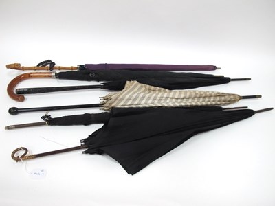 Lot 1379 - A Ladies Black Silk Parasol, with gilt snake...