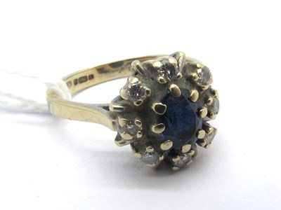 Lot 186 - An 18ct Gold Sapphire and Diamond Cluster Ring,...