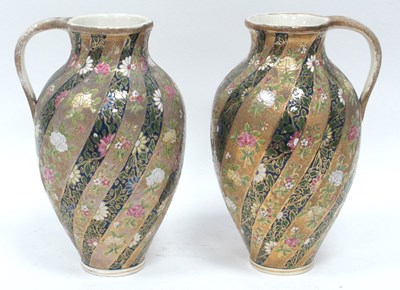 Lot 1073 - A Pair of Hungarian Pottery Ewers, richly...