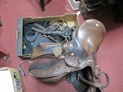 Lot 1057 - Brown Leather Horse Saddle, leather reins,...