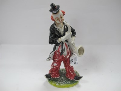 Lot 1262 - A vintage hand painted figure of a clown...