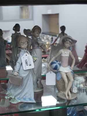 Lot 1267 - Three Lladro Figurines, of girls carrying...