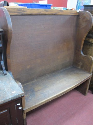 Lot 1548 - XX Century Oak Settle, with shaped sides...