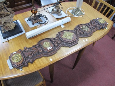 Lot 1523 - A large carved oak appliqué brass wall plaque...