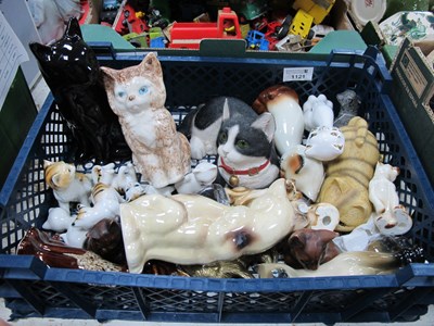 Lot 1121 - A collection of cat figurines mainly ceramic...
