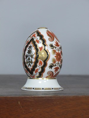 Lot 1281 - Royal Crown Derby Egg on a Stand, with a gold...