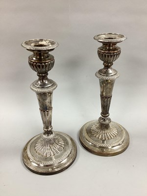 Lot 101 - A Pair of Plated on Copper Candlesticks, each...
