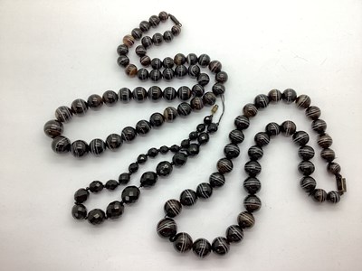 Lot 221 - Two Victorian Banded Agate Single Strand Bead...