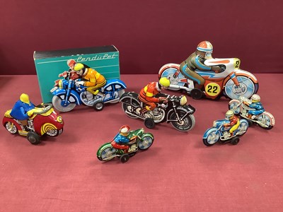 Lot 592 - Seven Post War Tinplate Motorcycles, by...