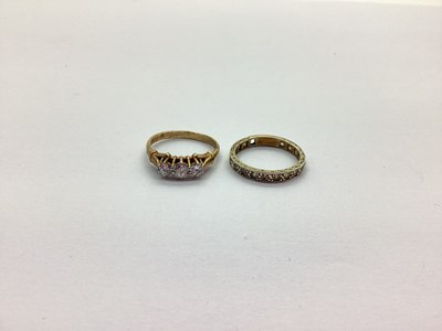 Lot 220 - A 9ct Gold CZ Three Stone Dress Ring,...