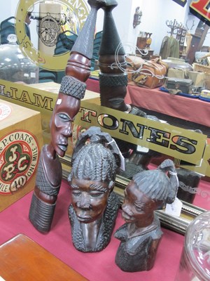 Lot 1342 - A pair of carved hardwood African busts of...