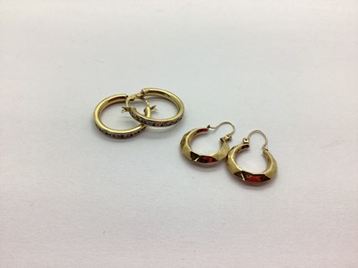 Lot 206 - A Pair of Modern Hoop Earrings, channel set...