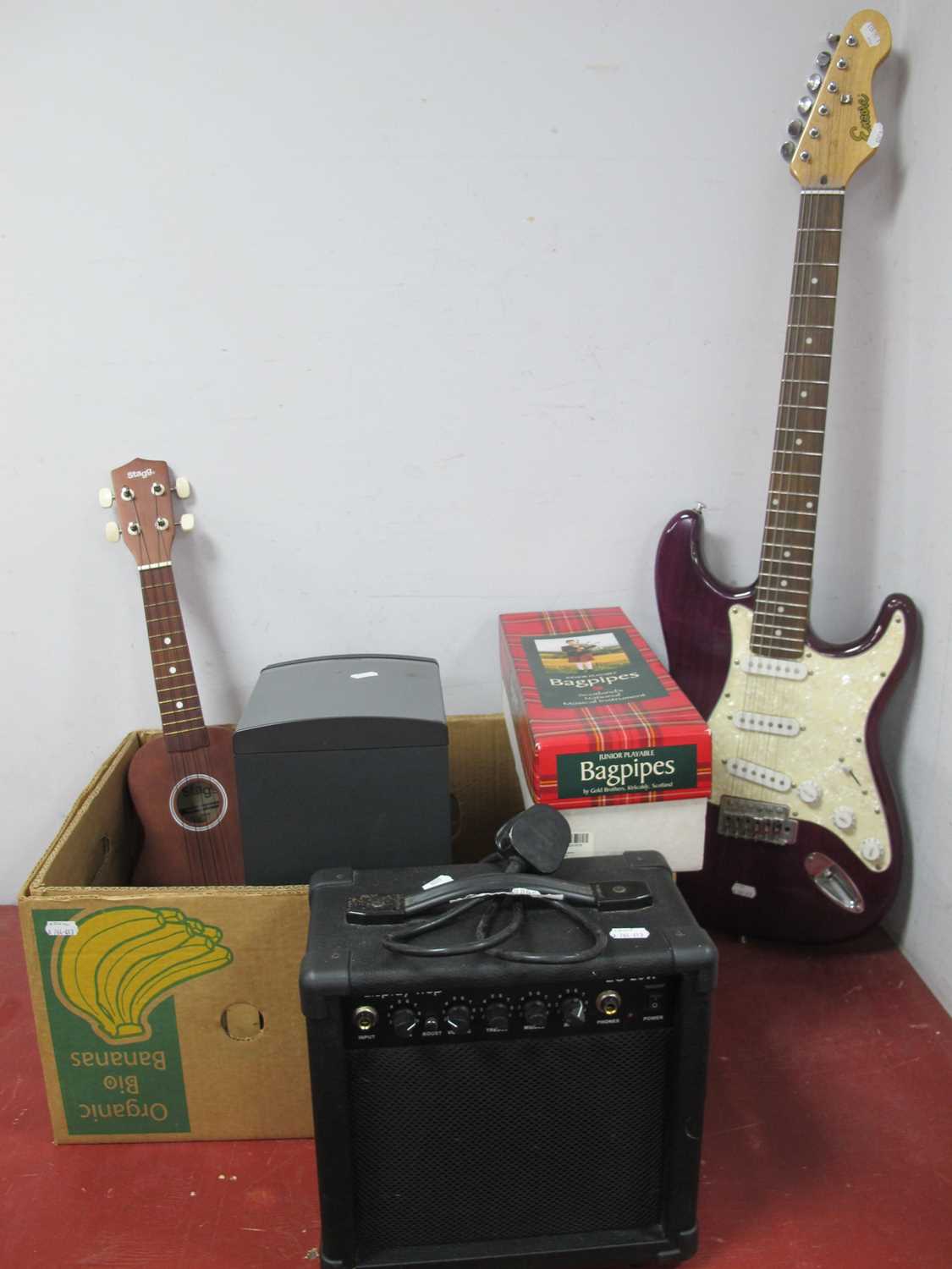 Lot 1042 - An Encore electric base guitar, Bose companion...