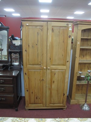 Lot 1483 - A Pine Twi Door Wardrobe, with single internal...