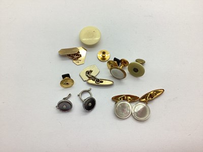 Lot 102 - A 9ct Gold Cufflink, (odd) (2grams); together...