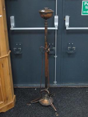 Lot 1504 - An early XX Century copper standard oil lamp...