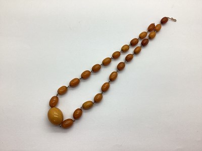 Lot 198 - An Amber Coloured Graduated Bead Necklace,...