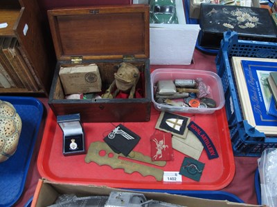 Lot 1402 - Military Cloth Badges, purse, gold soft toy...