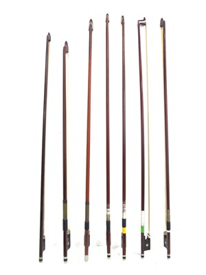 Lot 1325 - Seven Violin Bows, in various woods with...