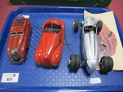 Lot 831 - Three Schuco (Germany) tinplate clockwork...