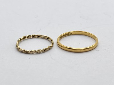 Lot 215 - A Slim 22ct Gold Plain Band, (finger size N);...