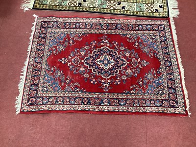 Lot 1617 - Middle Eastern Tassled Wool Rug, with floral...