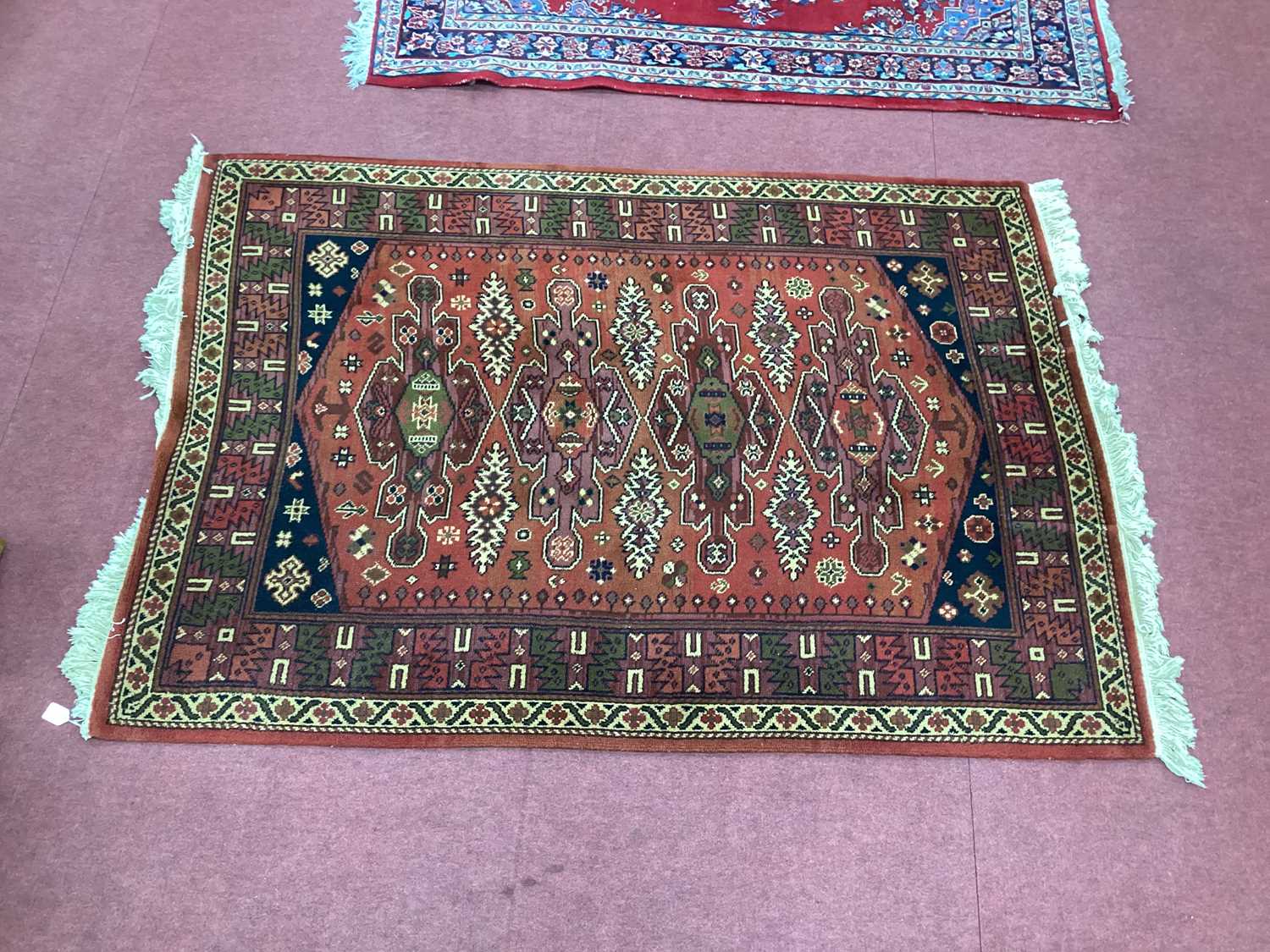 Lot 1578 - Adedis Kashmir Tassled Woold Rug, with four...