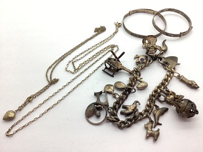 Lot 204 - A Vintage Curb Link Charm Bracelet, suspending...