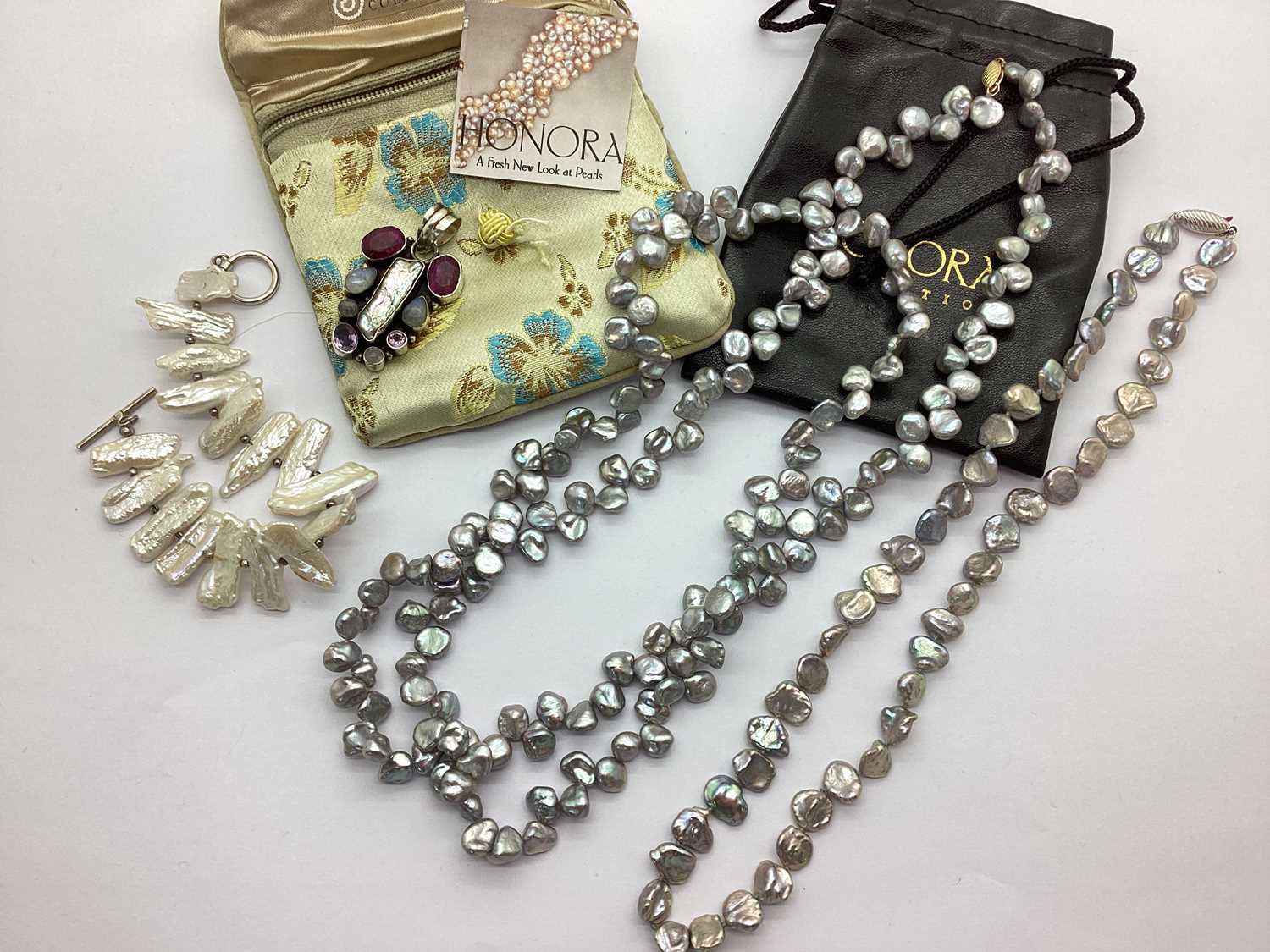 Lot 7 - Honora; A "14K" Gold Clasp Opera Length...