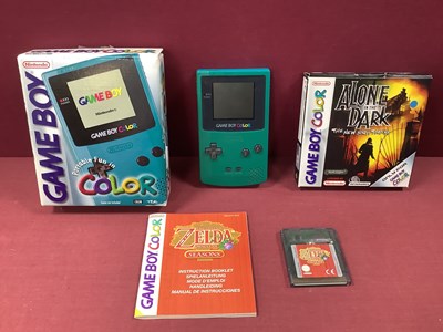 Lot 661 - A Nintendo Gameboy Colour 'Teal', boxed with...