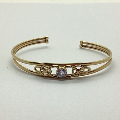 Lot 231 - A Hallmarked 9ct Stone Set Bifuricated Bangle,...