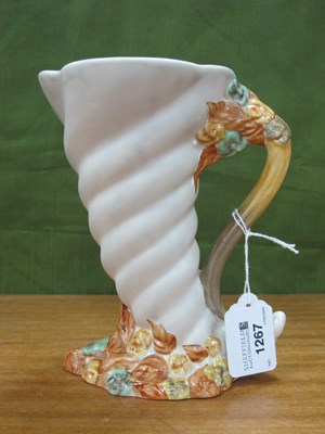 Lot 1267 - A Clarice Cliff Cornucopia Jug Vase, 18cm high.