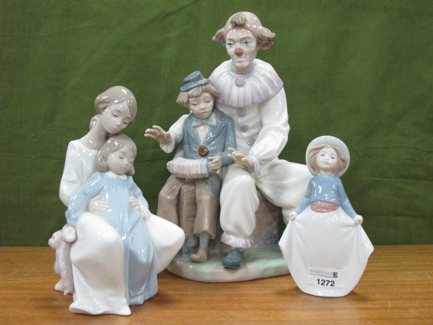 Lot 1272 - Nao Figure Group 'Clowns', 30.5cm high, and...