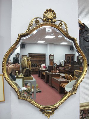 Lot 1535 - A XX Century Gilt Shaped Mirror, the top with...