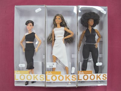 Lot 312 - Three Boxed Barbie Signature Looks Dolls; #1,...