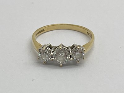 Lot 342 - A Modern Diamonique Three Stone Dress Ring,...