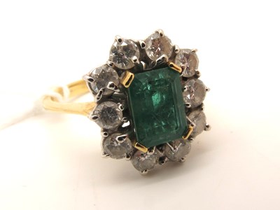 Lot 200 - An 18ct Gold Emerald and Diamond Cluster Ring,...