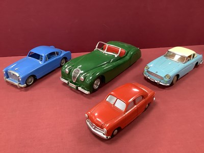 Lot 642 - Four Plastic and Tinplate Model Cars by Ideal...