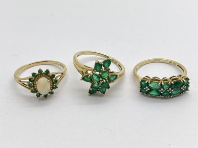 Lot 329 - A 9ct Gold Opal and Emerald Set Cluster Ring,...