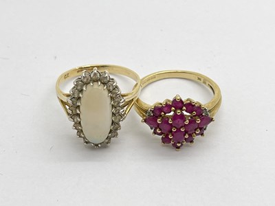 Lot 331 - A 9ct Gold Opal Cluster Ring, the elongated...