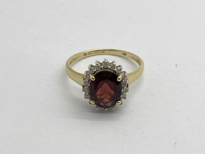 Lot 332 - A 9ct Gold Garnet and Diamond Set Ring, of...