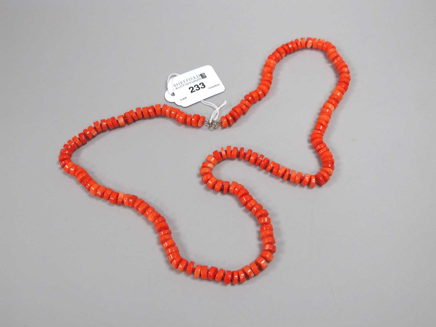 Lot 233 - A Modern Single Strand Coral Bead Necklace,...