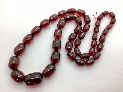 Lot 174 - A Cherry Amber Colour Single Strand Graduated...