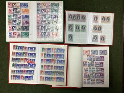 Lot 409 - Stamps, four small stockbooks containing a...