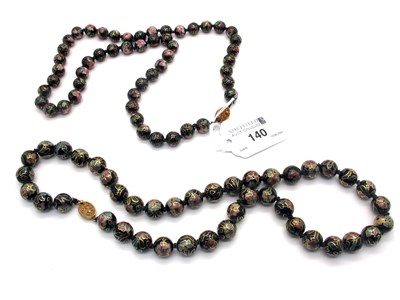 Lot 140 - A Cloisonné Bead Necklace, floral on a black...