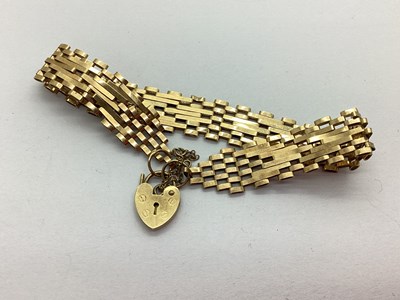 Lot 228 - A 9ct Gold Gate Link Bracelet, to heart-shape...