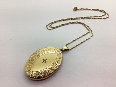 Lot 218 - A 9ct Gold Large Oval Locket Pendant, diamond...