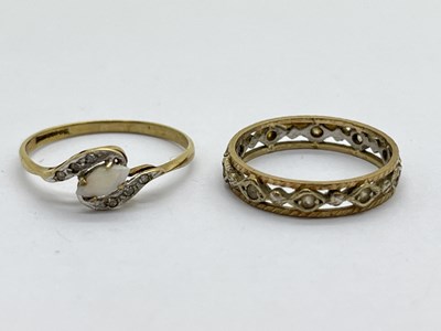 Lot 357 - A 9ct Gold Stone Set Ring, of crossover design,...